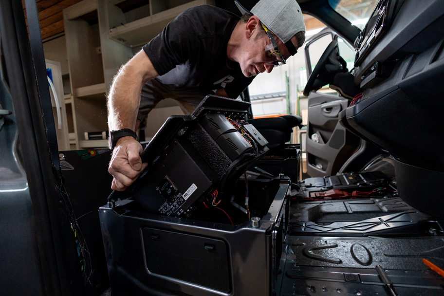 SAGA Vans team van build roam rig subwoofer install