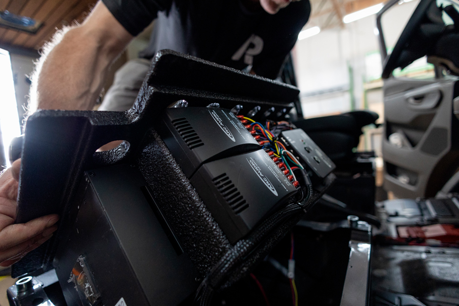 SAGA Vans team van build roam rig subwoofer install