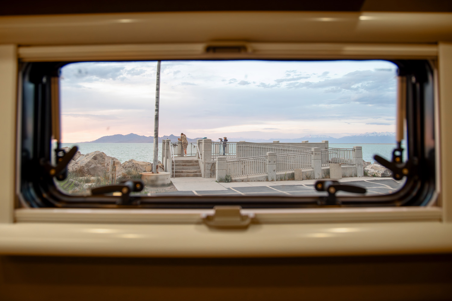 Looking through Arctic Turn pill style rear windows with shades and bugscreen Great Salt Lake